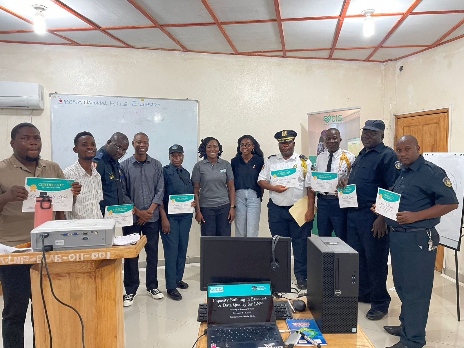 CIS and Liberia National Police personnel during research and data-quality training